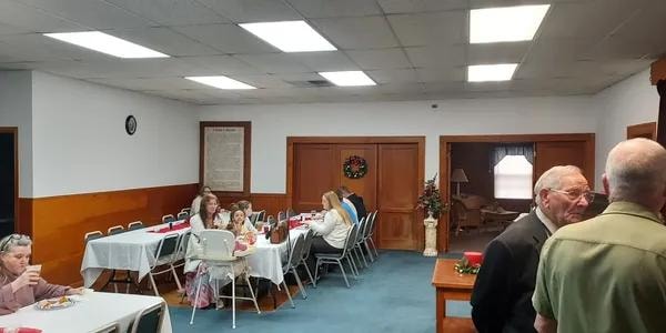 Fellowship hall with members gathered for the lunch